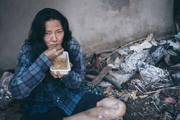 poor people,homeless or beggar begging for help sitting at dirty slum.concept for poverty...