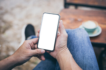 cell phone mockup blank white screen.woman hand holding texting using mobile on desk at coffee shop.background empty space for advertise.work people contact marketing business,technology