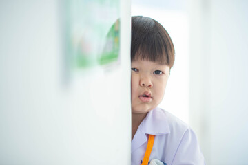 Portrait of little boy smiling at kindergarten school