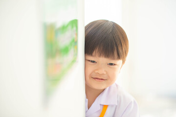 Portrait of little boy smiling at kindergarten school