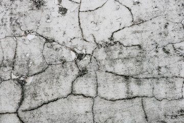 old concrete cement with cracks and natural destruction from time and weather conditions. 