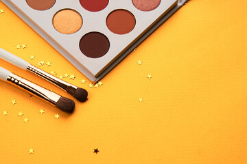 Professional cosmetics palette with eyeshadow makeup brushes cropped look
