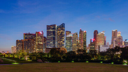 Naklejka premium Wide panorama image of Singapore skyscrapers at magic hour.