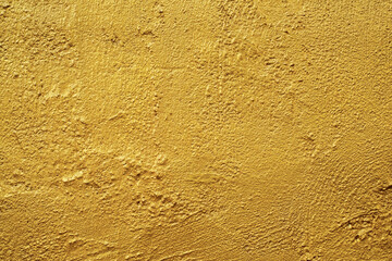 Golden wall texture rough background abstract concrete floor or Old cement grunge background with Gold empty.