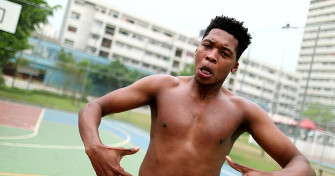 Black African man performing urban dance krump