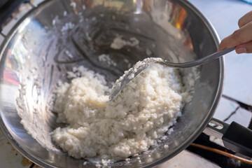 cooking coconut  in a pan
