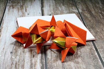 Traditional Chinese golden paper origami using for pay respect in ancient ceremony. Chinese culture and lifestyle concept.