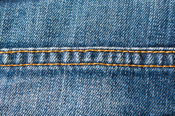 Denim texture. Seam on jeans. Close up. Selective focus.