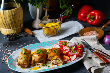 Vegetable roulade from roast  pork loins with salads