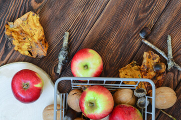 autumn healthy food decoration apples, nuts, leaves with copy space or design