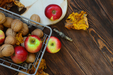 autumn healthy food decoration apples, nuts, leaves with copy space or design