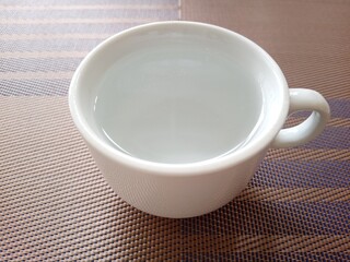 White coffee mug cup with hot water