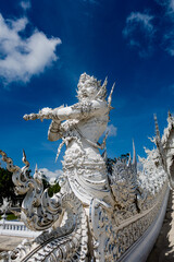 Place of worship, Wat Rong Khun also known as the white temple, located in Chiang Rai Province, Thailand. A unique style Buddhist temple with the bridge of “the cycle of rebirth”