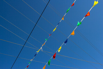 Intersection of stretched colored flags with power lines
