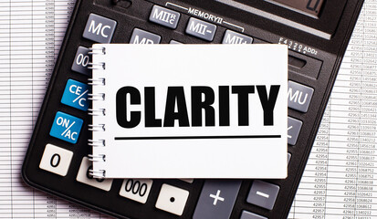 CLARITY word written on a white card on a calculator