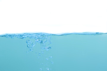 Water waves and light blue water droplets crystal clear on white background
