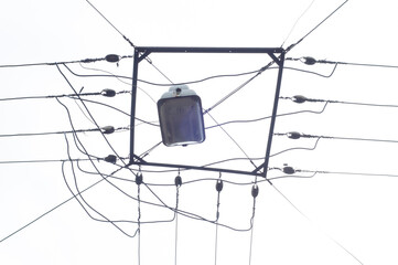 Trolleybus and tram wires supplying the city with electricity against the sky