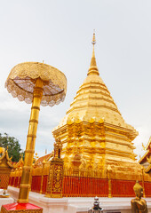 Fototapeta premium The golden pagoda of Doi Suthep, a beautiful glow at night. Beautiful public tourist spots in Chiang Mai, Thailand.