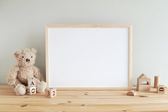 Nursery frame mockup, empty wooden horizontal frame for baby room or kids room wall art, print, photo.