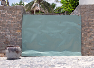 the hotel by the sea is still closed for quarantine. the access to the sea is closed by a large metal shield.