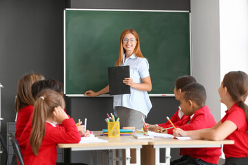 Teacher conducting lesson in classroom © Pixel-Shot