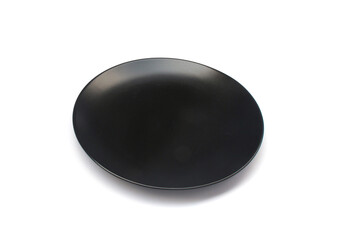 Empty ceramics black plate isolated on white background with clipping path