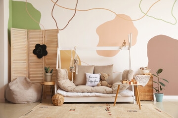 Interior of modern children's room with comfortable bed