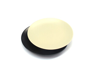 Empty ceramics white and black plate isolated on white background with clipping path