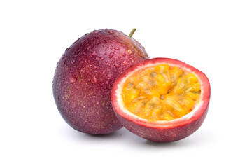 Purple passion fruit with cut in half and  water droplets isolated on white background..