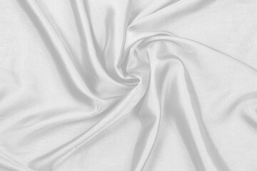 Obraz premium Smooth elegant white silk fabric or satin luxury cloth texture can use as wedding background. for drapery luxurious abstract design