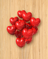 Red heart shape air balloons group on a wooden background