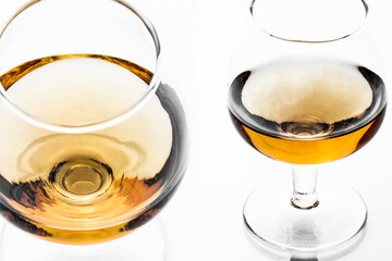Brandy glass isolated. Cognac alcohol background. Golden liquor closeup.