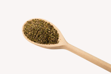 Oregano spice in wooden spoon isolated.