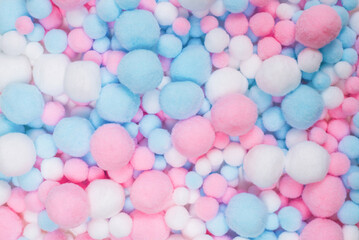 Fototapeta na wymiar White, pink and blue soft pompons.