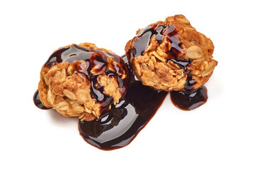 Homemade oat cookies with chocolate syrup, isolated on white background