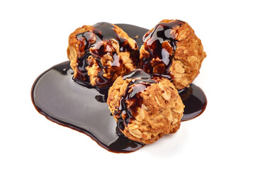 Homemade oat cookies with chocolate syrup, isolated on white background