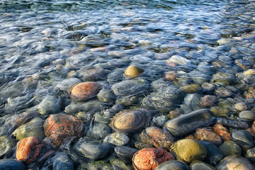 colored stones round the sea / texture wet rounded stones, wet multi-colored summer background