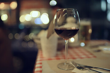 evening in a restaurant, blurred abstract background, bokeh, alcohol concept, wine glasses in a bar