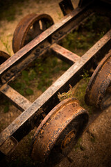 Metal wheels of an abandoned wagon