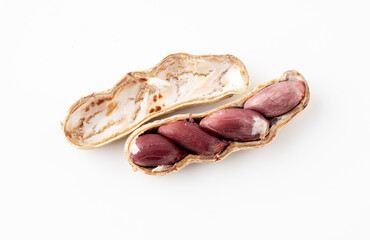Ripe peanuts, peeled and seen inside on a white background.