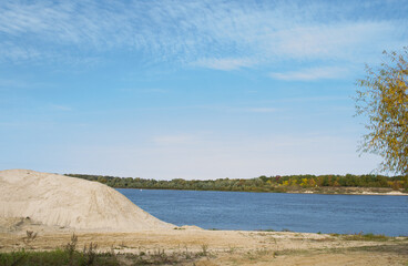 river,small ripples on the water,slow current,yellow sand Bank.