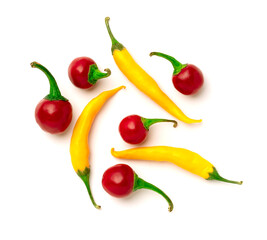 colored peppers over white background
