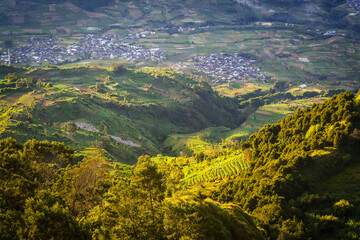 Aerial view countryside of Dieng village. Mountain scenery from above. 