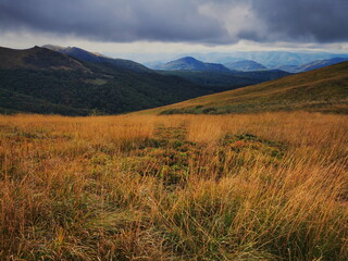 Autumn in the Bieszczady Mountains Poland. Mountain trails in the Bieszczady Mountains. Trekking in the Bieszczady Mountains. Yellow meadows in the Bieszczady Mountains.