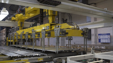 Modern robotic Aluminium extrusion production line factory warehouse. Plastic windows manufacture.