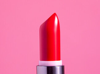 Fototapeta A red lipstick against pink obraz