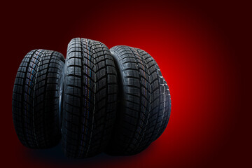 winter tyre cover on black red background