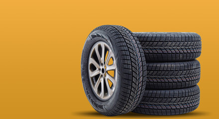 Car tires isolated on yellow background