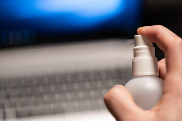 Covid19 disinfection of the business workplace with laptop working from home