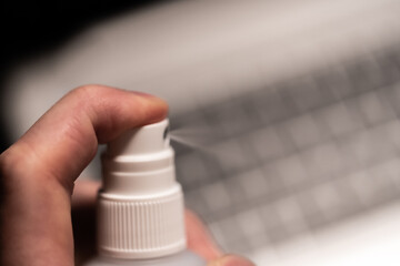 Covid19 disinfection of the business workplace with laptop working from home